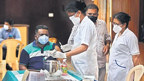 A Covid-19 vaccination drive organised by Kalamassery municipality and the public health centre, at Kalamassery town hall in Kochi on Tuesday. (Photo | Arun Angela/EPS)