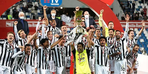 Juventus players celebrate with the winner's trophy their victory against Atalanta after the end of Italian Cup soccer final match at the Mapei Stadium in Reggio Emilia. (Photo | AP)