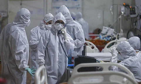 A doctor speaks on the intercom with a senior consultant giving an update of a patient. (Photo | AP)