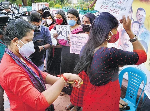 Woman CPO aspirants cut their hair in protest in front of the Secretariat in Thiruvananthapuram on Monday | Vincent Pulickal