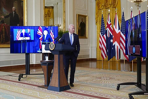 US President Joe Biden, joined virtually by Australian Prime Minister Scott Morrison, left, listen as British Prime Minister Boris Johnson during the unveiling of AUKUS. (Photo | AP)