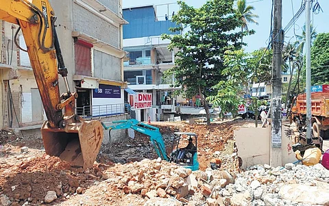The demolition of buildings in progress at Sreekaryam junction as part of the construction of the flyover