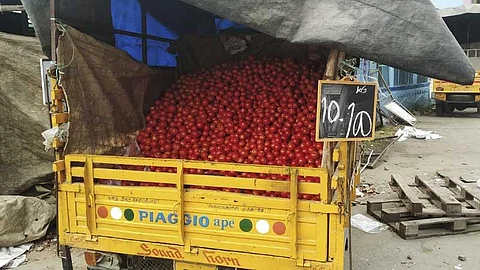 Tomato traders selling through a van near Thennampalayam market in Tiruppur city.