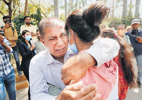 A student hugged by a family member on her return from Ukraine in Ahmedabad on Sunday