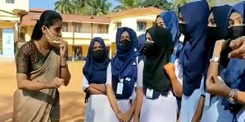 Muslim girl students, who tried to enter a government pre-university college at Kundapur in Karnataka's Udupi district wearing hijabs, were again denied entry to the premises. (Photo | ANI)