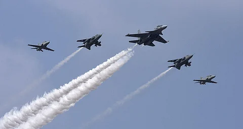 Indian Air Force's SU-30 aircraft in lead with two Jjaguar and two Hawk aircrafts fly in a formation over Yelahanka air base during Aero India. (Photo | Vinod Kumar T, EPS)