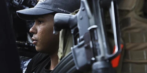 A young man is detained by the police, a suspect in a homicide near a market in San Salvador, El Salvador, Sunday, March 27, 2022.(Photo |AP)