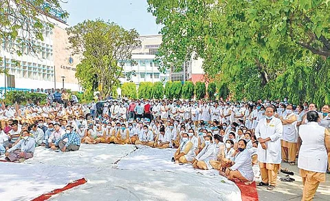 Nurses stage a sit-in protest at the GB Pant Hospital on Tuesday. ( Photo | EPS)