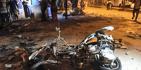 A torched scooter following the clash at Jahangirpuri on Saturday, April 16, 2022. (Photo | PTI)