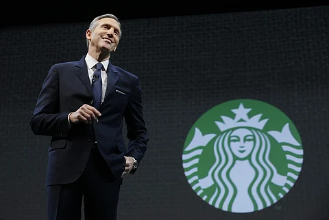 Starbucks halts stock buybacks as Schultz returns