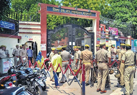 Police stand guard during the hearing of the Gyanvapi case, outside the Varanasi District Court. (File Photo | PTI)