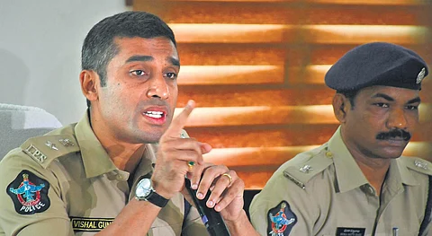 DCP Vishal Gunni addressing media persons after meeting with management of bars and restaurants in Vijayawada. (Photo| Prasant Madugala, EPS)