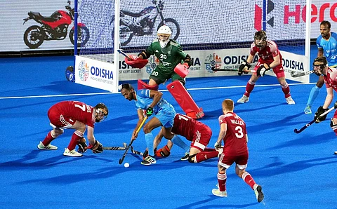 Indian player Hardik Singh tries to score a goal against England during the FIH Odisha Hockey Men's World Cup 2023 at Birsa Munda Stadium, in Rourkela, Jan. 15, 2023. (Photo | PTI)