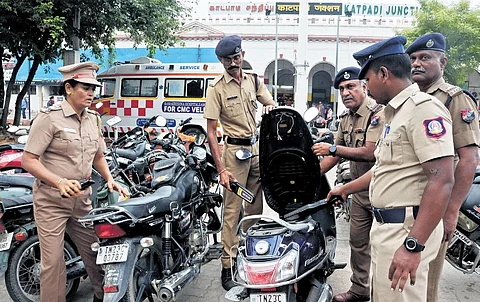 Police personnel checking vehicles parked at the railway station in Katpadi on Sunday | s dinesh