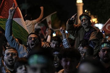 People chant anti-Israel slogans while waving Palestinian flags during a rally celebrating the attacks that the militant Hamas group carried out against Israel, in Istanbul, Turkey. (Photo | AP)