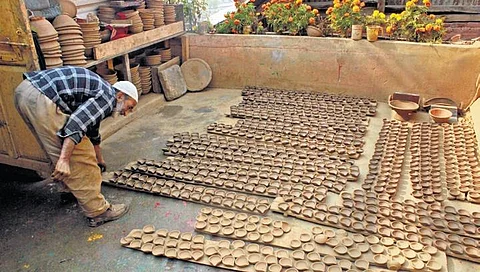 Muhammad Umar works at his pottery unit in Nishat in the outskirts of Srinagar
