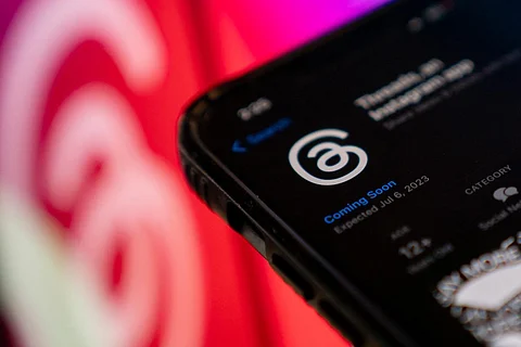 FILES -Â This photo illustration created in Washington, DC, on July 5, 2023, shows Threads, an Instagram app, on the App Store, in front of the logos of Instagram and Threads. (AFP Photo)