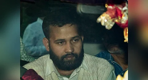 Lalit Jha, key accused in the recent Parliament security breach, being produced at the Patiala House Court, in New Delhi on Friday, December 15, 2023. (Photo | PTI)