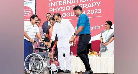 VR Venkataachalam, chancellor, distributing wheelchairs. (Photo | Express)