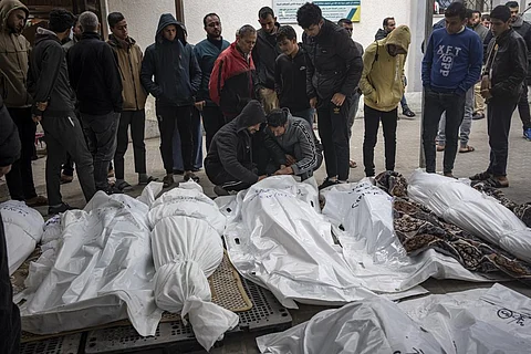 Palestinians mourn their relatives killed in the Israeli bombardment of the Gaza Strip, at the hospital Rafah, southern Gaza. (Photo | AP)