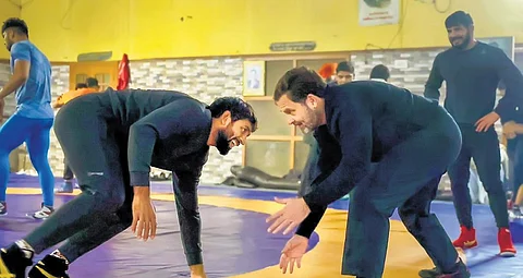 Fighting fit: Rahul wrestles it out at akhara in Jhajjar