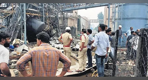 Officials assessing the damage caused due to the blast at GMFC labs at SEZ in Anakapalle district in Visakhapatnam on Tuesday | express