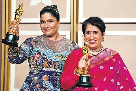 Kartiki Gonsalves (L) and Guneet Monga pose with their awards for “The Elephant Whisperers” at the Oscars on Monday | ap/pti