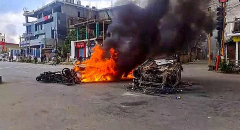 Vehicles in flames after violence broke out during the 'Tribal Solidarity March' called by All Tribal Student Union Manipur (ATSUM), in Imphal. (Photo | PTI)