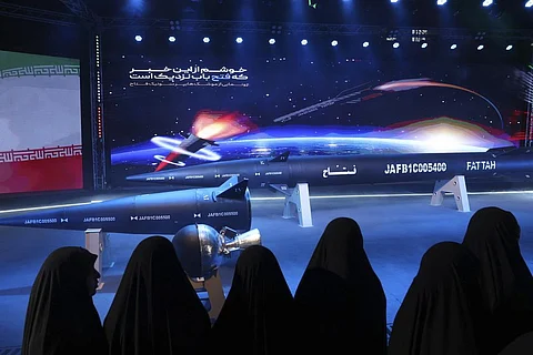 Women look at Fattah missile in a ceremony in Tehran, Iran, Tuesday, June 6, 2023. Iran is claiming that it's created a hypersonic missile capable of traveling at 15 times the speed of sound. (AP)