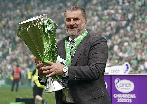 Ange Postecoglou celebrates with the league trophy after winning the Scottish Premiership with Celtic (Photo | AP)