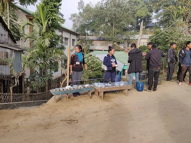 Volunteers making food arrangements at Kanhmun polling booth. (Photo | Special Arrangement)