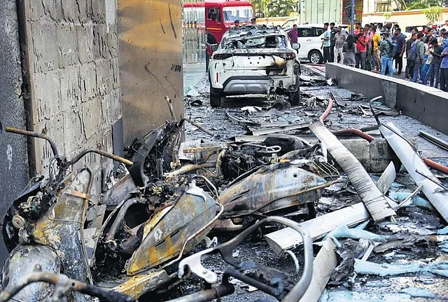 Charred remains of the vehicles that were parked beside the KDP building | Express