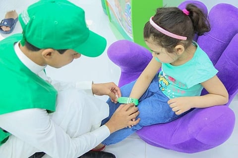 Free bracelets prevent children from getting lost in Grand Mosque