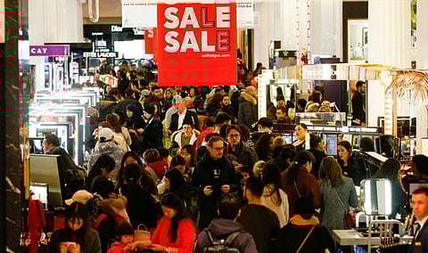 Shoppers are seen inside the Selfridges store on Oxford Street
