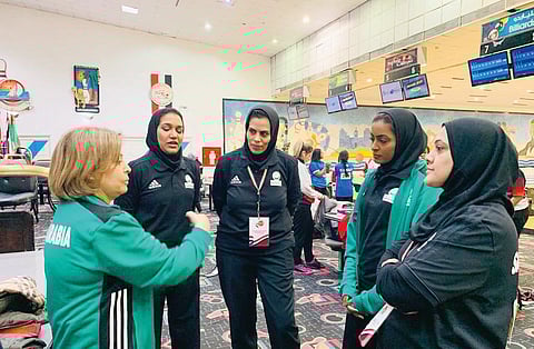 The first all-female Saudi bowling national time with their coach