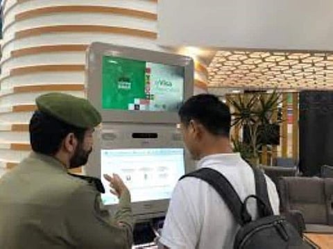 The first Chinese tourist completes the e-tourist visa procedures in King Khalid International Airport