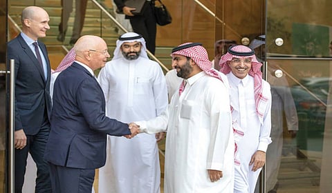 Saudi Culture Minister Prince Badr bin Abdullah greets WEF founder Klaus Schwab in Riyadh on Wednesday. (SPA)