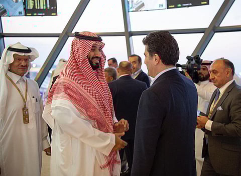 Saudi Arabia’s Crown Prince with a guest along with Prince Abdulaziz bin Salman, Minister of Energy. (SPA)