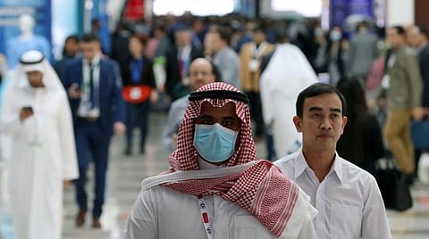 A vistor wears a mask during the Arab Health Exhibition in Dubai, United Arab Emirates January 29, 2020. REUTERS/Christopher Pike
