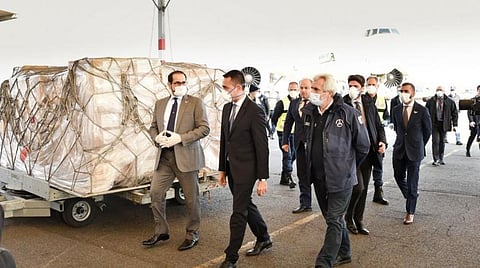 Omar al-Shamsi, UAE Ambassador to Italy, pictured centre in a black suit, is shown the medical equipment shipment before it is sent on to hospitals. Courtesy: Ministry of Foreign Affairs and International Cooperation