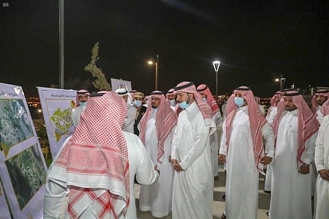 Acting Minister of Municipal and Rural Affairs Majid Al-Hogail being briefed on a project in Al-Baha. — Courtesy photo