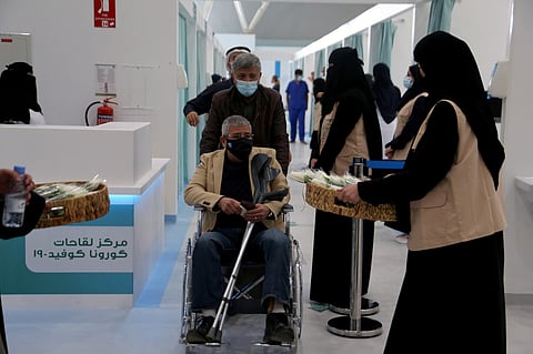 A man in a wheelchair leaving after he received dose of a coronavirus disease (COVID-19) vaccine, in Riyadh, Saudi Arabia December 17, 2020. (Reuters)