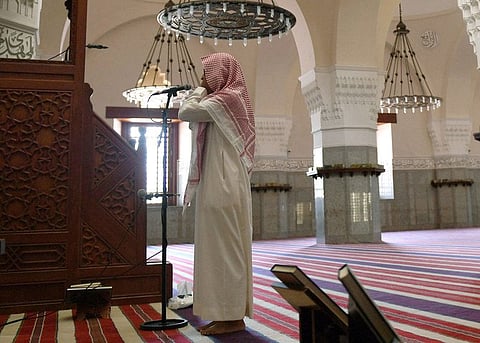 In this file photo taken on April 28, 2020, muezzin of the Jaffali mosque in Jeddah, calls for prayer at the mosque. (AFP)