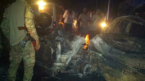 Security personnel inspect the site of an explosion outside Aden international airport in Aden, Yemen, October 30, 2021. (Reuters)