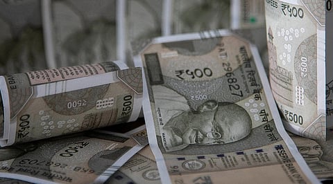 Rupee slips to over 2-month low on portfolio outflows, RBI likely steps in