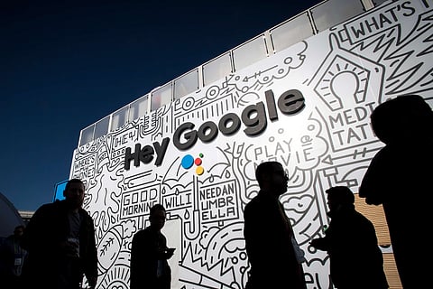 The silhouettes of attendees are seen at the Google Inc. booth during the 2018 Consumer Electronics Show (CES) in Las Vegas, Nevada, U.S., on Thursday, Jan. 11, 2018. Electric and driverless cars will remain a big part of this year's CES, as makers of high-tech cameras, batteries, and AI software vie to climb into automakers' dashboards. Photographer: David Paul Morris/Bloomberg via Getty Images