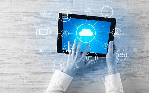 Hand touching tablet with cloud computing and online storage concept