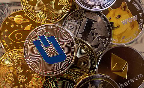 FILE PHOTO: Representations of virtual cryptocurrencies are seen in this illustration taken November 28, 2021. REUTERS/Dado Ruvic/Illustration