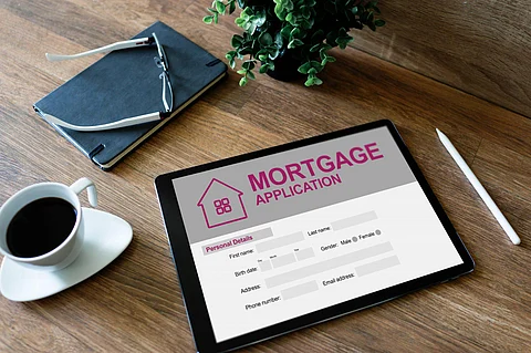 Online mortgage application on screen. Property loan. Business and financial concept