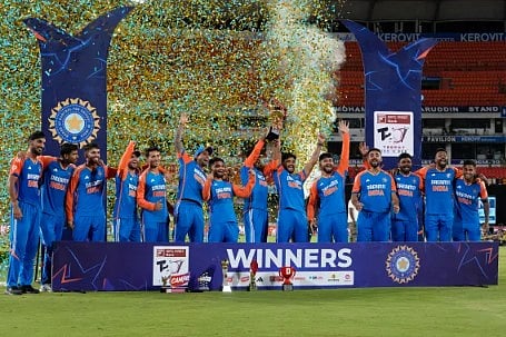 Indian players celebrate with the trophy after winning the T20 cricket series against Bangladesh in Hyderabad,